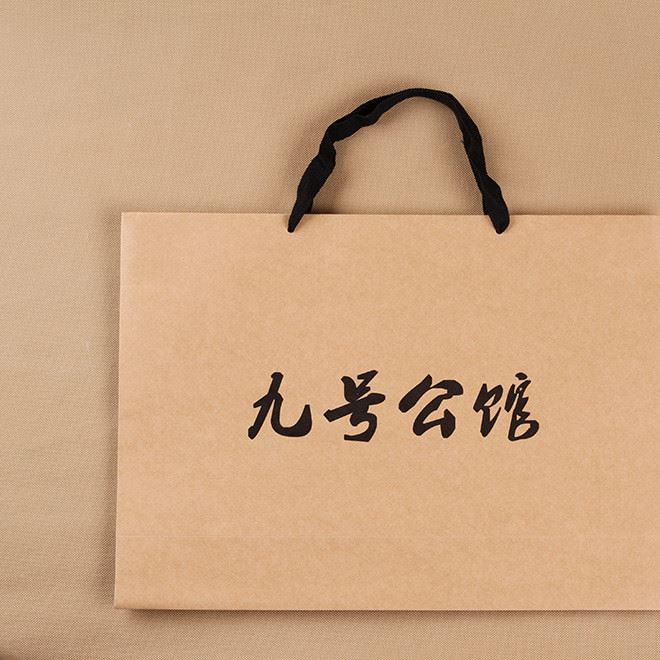 廠家定做牛皮紙服裝手提包裝紙袋定做可印logo手提外貿(mào)禮品紙袋子示例圖4